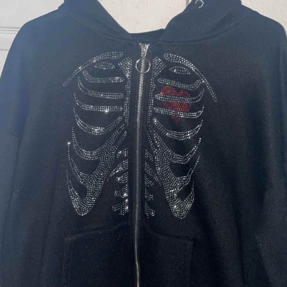 black zip-up with skeleton rhinestone design